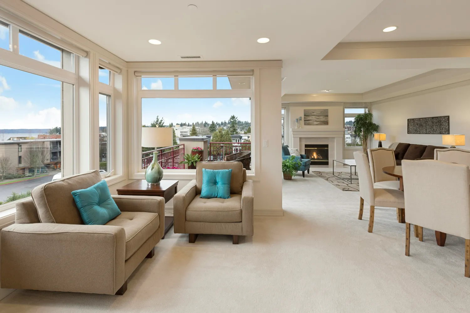 A bright open-plan living and dining area with tall windows